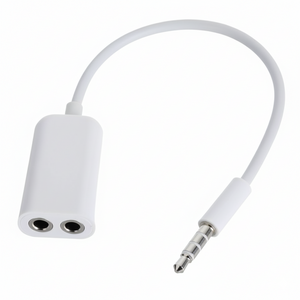 White audio adapter with two headphone sockets and a 3.5mm jack on a white background