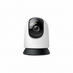 White security camera with black lens on a white background