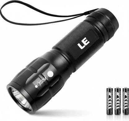 Black flashlight with 'LE' branding on a white background