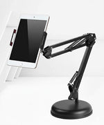 Black adjustable desk stand holding a tablet on a white background